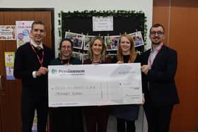 Cllr Eleanor Thomson, Deputy Executive Member, Children and Families at Leeds City Council and Persimmon presenting the cheque to the school