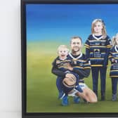 Brent Sheldon's painting of Rob Burrow with his children Jackson, Macy and Maya. Picture by Brent Sheldon.