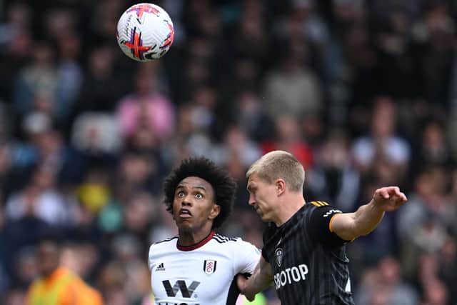NIGHTMARE: For Leeds United's Rasmus Kristensen, right, taken to the cleaners by Fulham's Brazilian winger Willian, left, at Craven Cottage.
Photo by JUSTIN TALLIS/AFP via Getty Images.