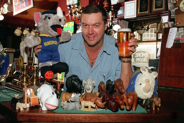 Leeds Rhinos fan Keith Lewis Broughton, landlord of the City of Mabgate Inn, Mabgate, Leeds, pictured with his collection of rhinos, bought for him by regulars from all over the world.