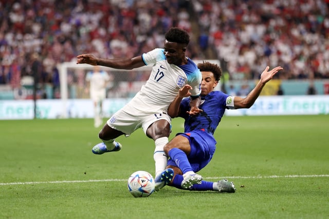 Tyler Adams gets stuck into Arsenal and England winger Bukayo Saka (Photo by Ryan Pierse/Getty Images)