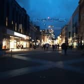 Briggate, in Leeds city centre, pictured half in darkness following a power cut.