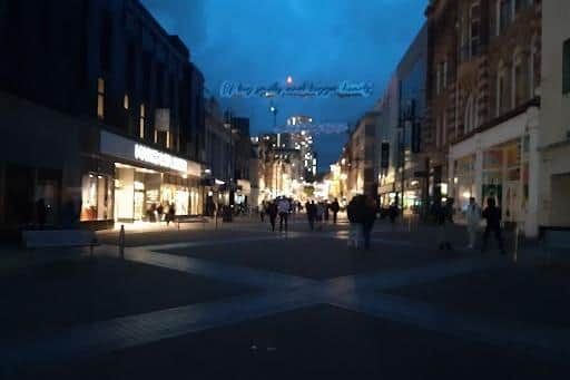 Briggate, in Leeds city centre, pictured half in darkness following a power cut.