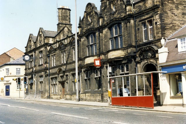 Harrogate Road showing Chapel Allerton Branch Library in the centre, with the Police Station and Midland Bank to the left and The Leeds Building Society partly visible on the right. A bus shelter is seen in front of the library.