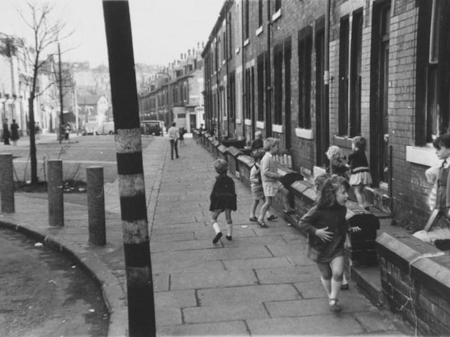 Children play on Burley Lodge Road in October 1970.