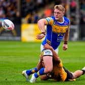 James McDonnell gets a pass away during Leeds Rhinos' win at Castleford Tigers last August. Picture by Olly Hassell/SWpix.com.