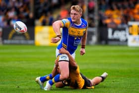 James McDonnell gets a pass away during Leeds Rhinos' win at Castleford Tigers last August. Picture by Olly Hassell/SWpix.com.