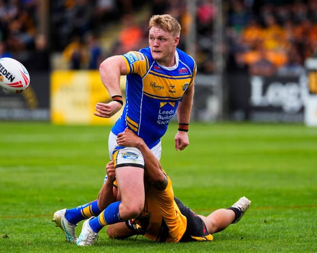 James McDonnell gets a pass away during Leeds Rhinos' win at Castleford Tigers last August. Picture by Olly Hassell/SWpix.com.