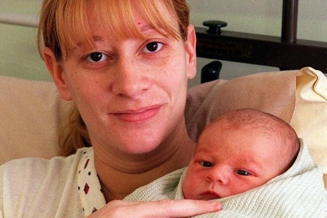 The first baby born on Christmas Day at St James's Hospital in 1999 was a little boy, Daniel Birks, pictured with his mum, Shelley.