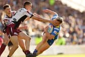 Castleford Tigers' Innes Senipor grapples with Alfie Edgell of Leeds Rhinos. Picture by John Clifton/SWpix.com.