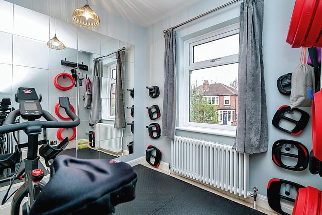 There is also a single/home office room that is being used as a gym.