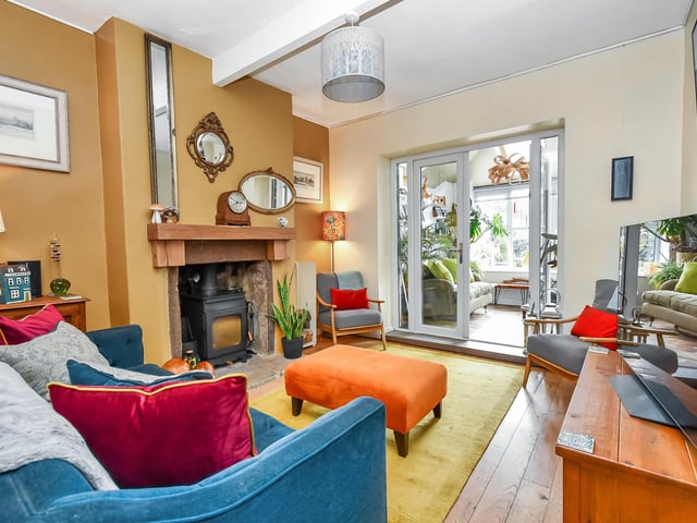 The adjacent lounge is the perfect place to unwind, with a cozy fireplace adding to the overall ambiance.