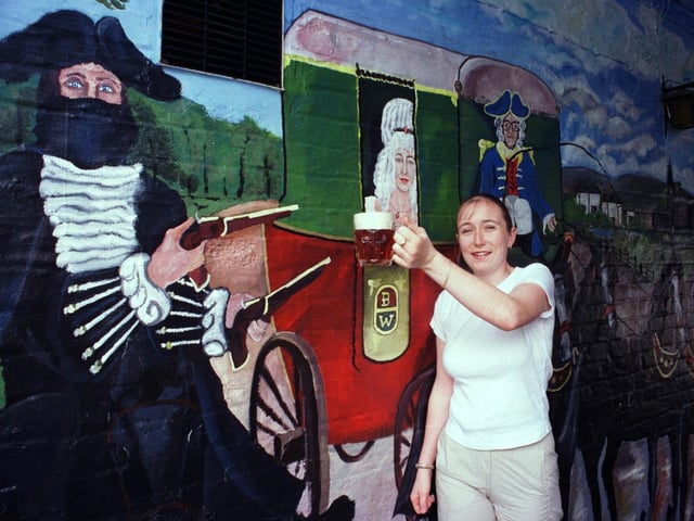 Hold up for a paint of the best. Pictured is Stacey Gill, the face of the lady in the stage coach mural on the wall of The Pack Horse in August 1999. Dick Turpin is said to have used the pub as one of his watering hole during his years as an outlaw.