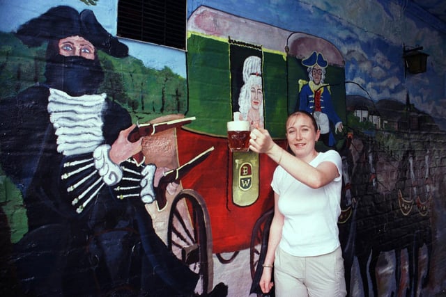 Hold up for a paint of the best. Pictured is Stacey Gill, the face of the lady in the stage coach mural on the wall of The Pack Horse in August 1999. Dick Turpin is said to have used the pub as one of his watering hole during his years as an outlaw.