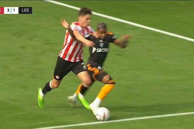 Crysencio Summerville is impeded by Brentford's Aaron Hickey during the Whites' 5-2 defeat by Brentford. No penalty awarded. (Pic: BBC)