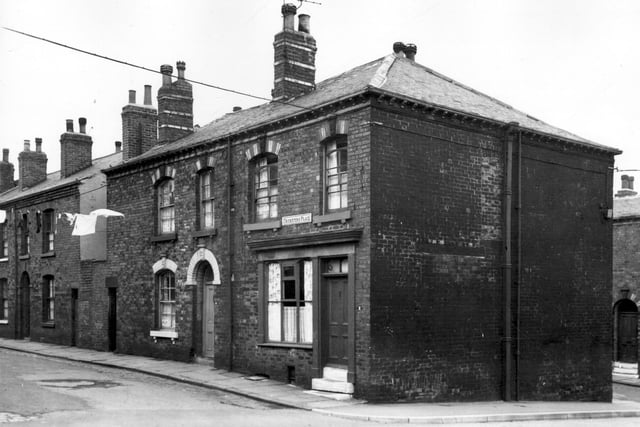 This view looks from Wesley Road onto back to back houses on Cricketers Place in May 1965. Number 2 had been a shop although at the time of this view it was used as a residential property.