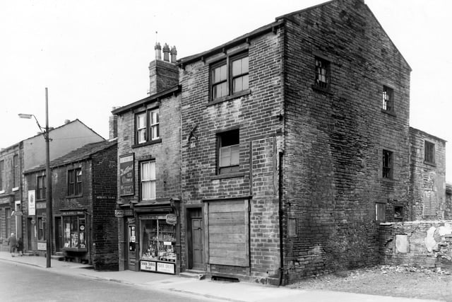 Shops and business premises in Lower Town Street in March 1960. Far left is number 96, Frederick J. Rogers, Ltd, well respected for the quality of the organ pipes manufactured here at home and abroad. Adjacent is a tobacconists at number 94, then Miss A. King, Wool Shop at number 92 next to the entrance to Spetch Yard. Shops continue with an off-license at number 90 and a semi-derelict, boarded-up property at number 88. Demolition of buildings in Lower Town Street has begun to take place, right.