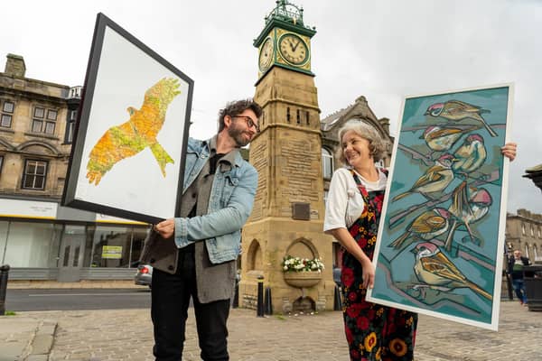 Yorkshire artists Kim Coley (left) and James Davis are pictured in Otley Market Square previewing some of their work which will appear along with work by 30 artists
and wildlife photographers at the third Otley Wildlife Arts Festival this coming weekend (October 6-8). Image: SIMON DEWHURST