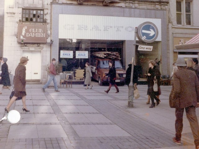 Kirkgate in February 1983, formerly occupied by Grafton's, now closed down. This was shortly to be taken over by Thrifty Clothes. Club Damien nightclub occupies the upper storey, with an entrance on the right.