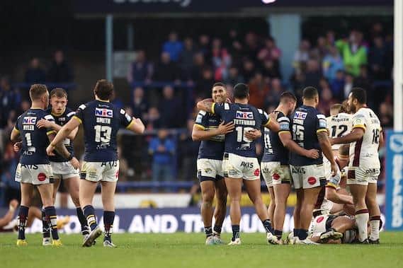 Rhinos celebrate as the final whistle sounds against Huddersfield. Picture by John Clifton/SWpix.com.