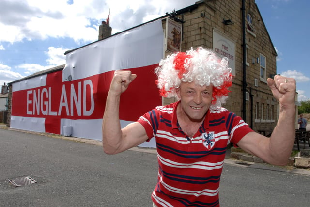 Craig Jones. landlord of The Cricketers Arms, Seacroft with a giant England flag at the pub.