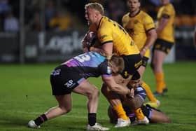 Castleford Tigers' Jack Ashworth is tackled by Hull FC duo Jeremiah Mata'utia and Brad Fash at OneBore Stadium in April. Picture by John Clifton/SWpix.com.