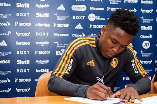 Luis Sinisterra signs his Leeds United contract at Elland Road (Image: Leeds United)