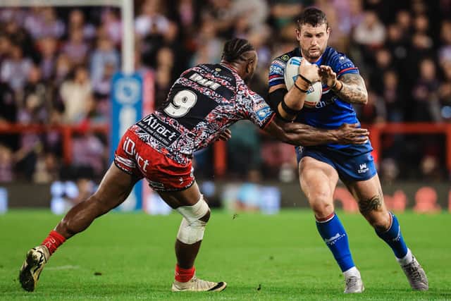Jay Pitts is tackled by Edwin Ipape during Wakefield Trinity's Super League win at Leigh Leopards earlier this month. Picture by Alex Whitehead/SWpix.com.