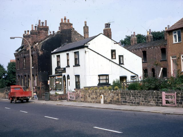 Laneside Buildings and Kirk Villa in Elland Road at the top of Churwell Hill in August 1968. Kirk Villa is the grocer's shop of A. & B. Jackson at number 4 Laneside Terrace. Kirk Villa was the original name for Morley Grange which once stood on the opposite side of Elland Road.