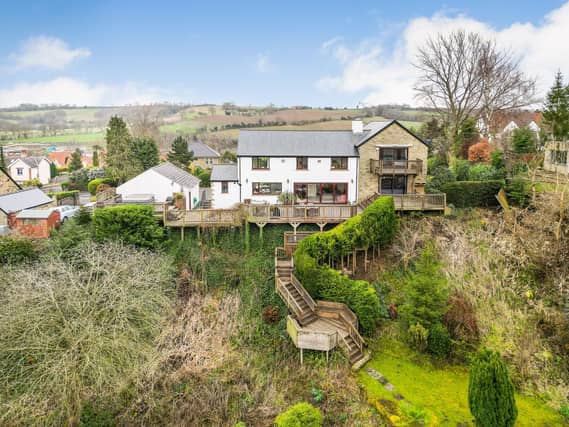 Steps lead down from the house and through gardens to the River Wharfe.