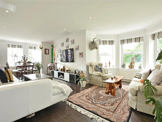 The good sized lounge/diner has dual aspect windows, down lighting and laminate flooring.