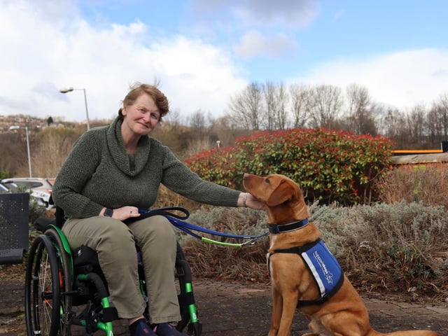 Amanda Davidson with newly-qualified support dog Chris