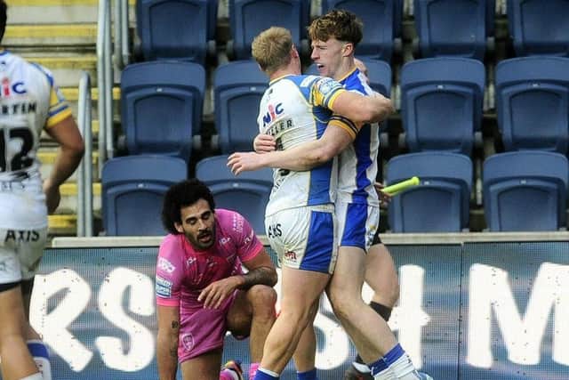 Ned McCormack, right, celebrates with Leeds Rhinos teammate Lachie Miller after scoring in a pre-season game against Hull KR. Picture by Steve Riding.