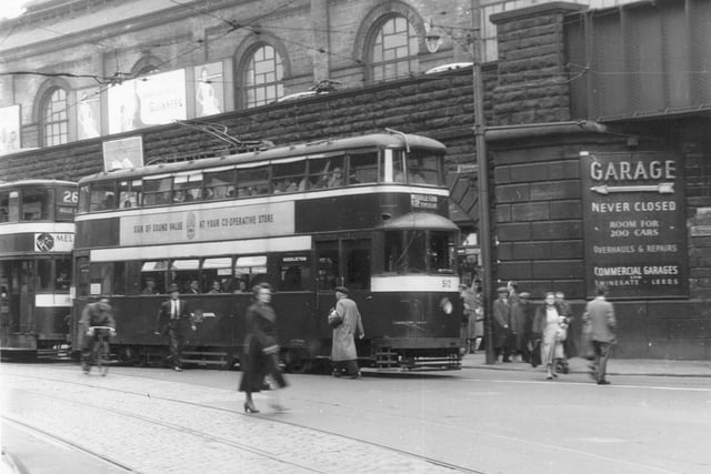 Trams on Mill Hill in July 1956. Leeds City Railway Station can be seen beyond the bridge.
