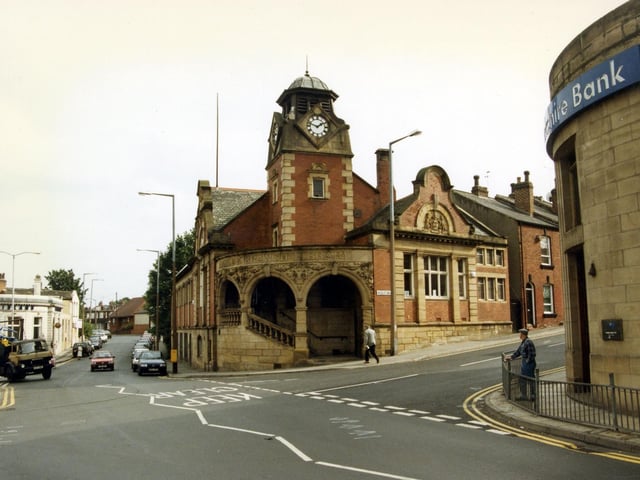 Looking from Town Street towards Armley Branch Library at the junction with Wesley Road, right, Stocks Hill up ahead, and Branch Road and Crab Lane on the left. The Yorkshire Bank is seen on the corner on the right and the Midland Bank is the white building on the left.