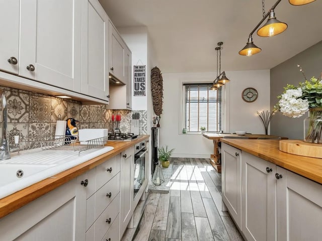 The open plan dining kitchen has many features that are perfect for family style living.