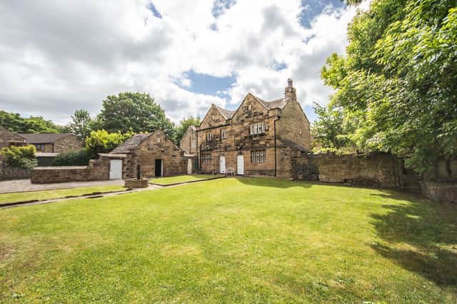 An historic Hall with attractive gardens is a comfortable home with potential for development.