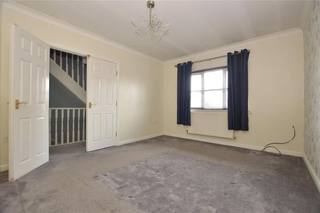 To the first floor is a landing with built-in storage cupboard and a large, spacious master bedroom.