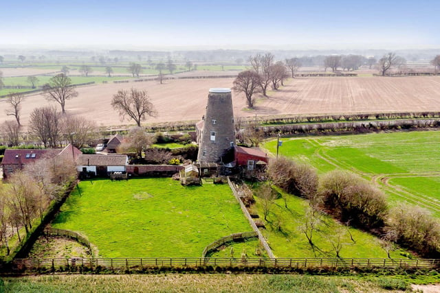 The property has charming gardens and is surrounded by farmland and countryside