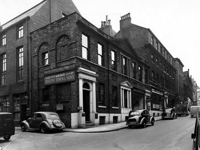 The junction of Albion Street and Butts Court (on the left) in August 1949. The premises are (Albion Street); number 77, G.L. Barker, accountant; number 79, J.W. Bulmer, tailor; number 81, Hindle, Son & Lewis, estate agents. On Butts Court are the premises of Wiggins, Teape & Alex Pirie Ltd, paper makers, and Allied Paper Merchants Ltd. (Joseph Towne & Sons).