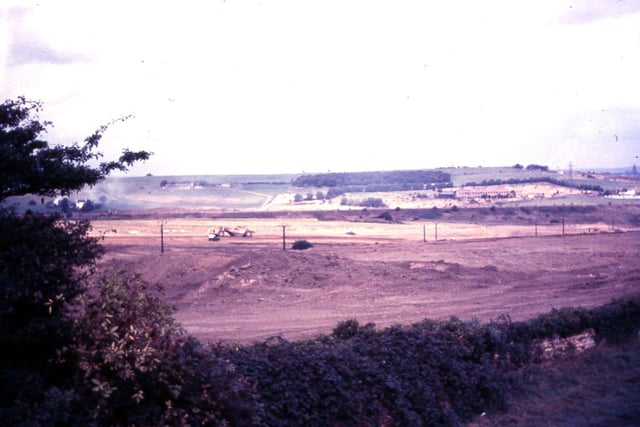 A view taken from Sanderson's farm at Churwell, looking over Daffil Wood towards Cottingley Springs, showing construction work on the M621 Gildersome to Leeds motorway in progress. Taken sometime between 1971 and 1973.