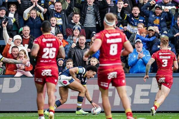 Derrell Olpherts scores for Rhinos in thier Saturday home win over Catalans on March 25. The French side will make another Saturday visit on March 2 next year. Picture by Alex Whitehead/SWpix.com.