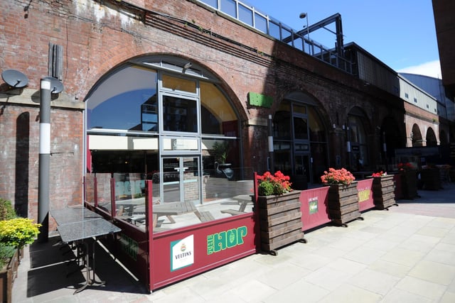 Granary Wharf. “Sited in two of a network of brick arches built in the 1860s to span the river and support the new station, the Hop is a lively pub on two levels with plenty of exposed brick and some music-inspired murals.”