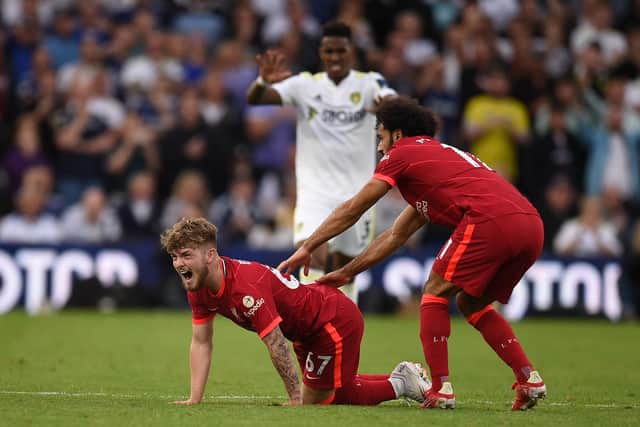 Liverpool's English striker Harvey Elliott (L) suffers a serious leg injury following a tackle by Leeds United's Dutch defender Pascal Struijk (not seen) during the English Premier League football match between Leeds United and Liverpool at Elland Road in Leeds, northern England on September 12, 2021.