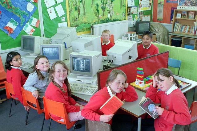 Cookridge Primary School pupils make use of the new after school facilities. Pictured at the front reading are Eloise Harris (left) and Suzanne Dunham. On the computers are, from left, Manvi Mittal, Katey LeCompte and Catriona Harris and Callum Tait (left) with Hardev Saimbhi.
