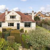 A substantial four bedroom, detached 1930s family home is on the market with scope for further extension. There is a study and three ground floor reception areas in superb gardens with parking, a car port and a detached garage.