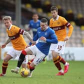 MOTHERWELL, SCOTLAND - JANUARY 17: Ryan Kent of Rangers is challenged by Robbie Crawford of Motherwell during the Ladbrokes Scottish Premiership match between Motherwell and Rangers. (Photo by Ian MacNicol/Getty Images)
