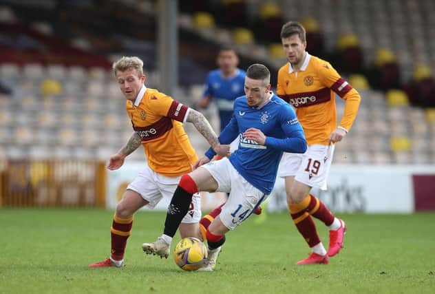 MOTHERWELL, SCOTLAND - JANUARY 17: Ryan Kent of Rangers is challenged by Robbie Crawford of Motherwell during the Ladbrokes Scottish Premiership match between Motherwell and Rangers. (Photo by Ian MacNicol/Getty Images)