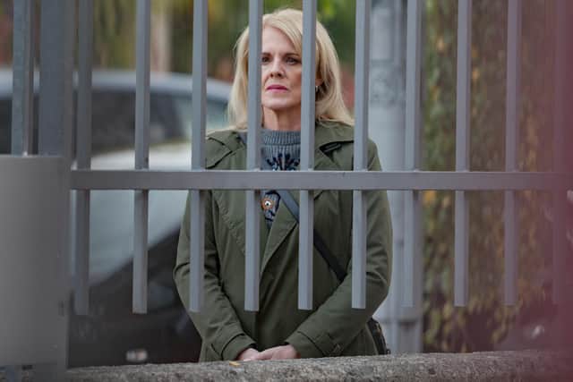 Donna (Sally Lindsay ) watches Lucy collecting Poppy from school in Channel 5 drama Number One Fan (Picture: Clapperboard/Channel 5)