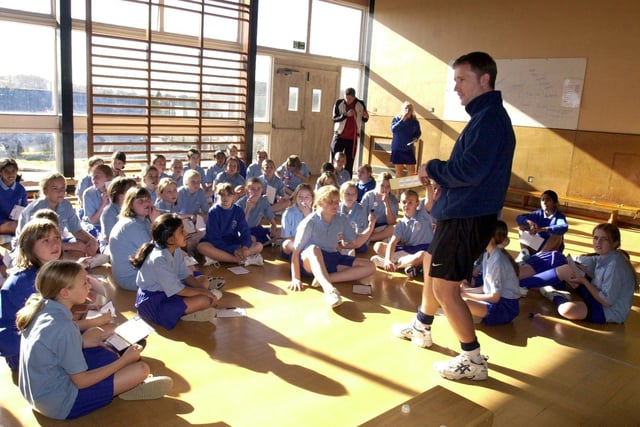Teacher Mike Barnes with Year 7 pupils at Priesthorpe High School  after they took part in circuit  training as part of the Sporting Chance initiative. The session featured coaching from Tracy Neville, the most capped England Netball player and sister of Gary and Phil Neville. Pictured in October 2003.